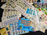 a lot of stamps on the table with a lot of them