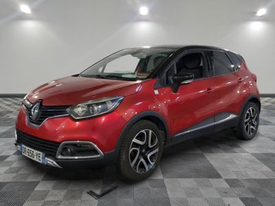 a red car is parked in a room with a checkered floor