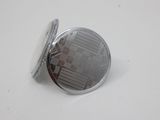 a close up of a button on a white surface