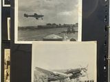 an old black and white photo of a plane on a runway