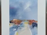 framed watercolor painting of cows crossing a road in a rural area
