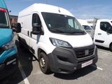 a white van that is parked in a parking lot