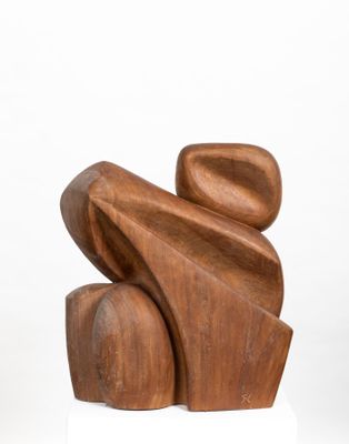 sculpture made of wood on a white pedestal
