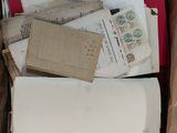 a box full of mail sitting on the floor