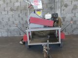 a machine that is sitting on a cart in a garage