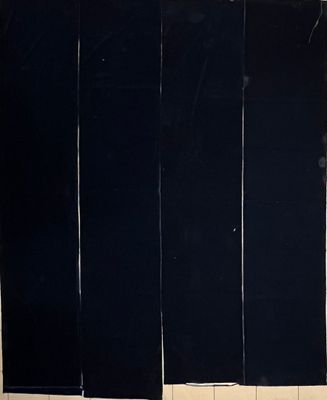 four pieces of black fabric hanging on a wall next to a toilet