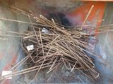 a pile of sticks in the middle of a dumpster