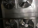 many fans that are on the wall in the room