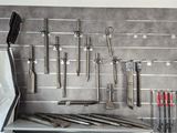 many tools hanging on the wall in the kitchen