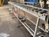 a machine that is working on a conveyor belt