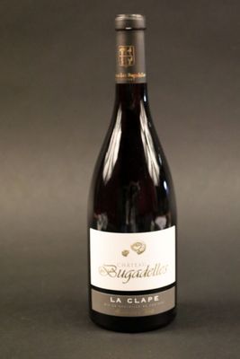 a bottle of wine that is sitting on a table