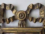 a picture of a mirror hanging on a wall