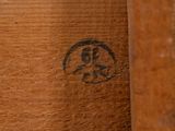 a close up of a piece of wood with a picture of a monkey on it