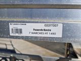 a close up of a metal bench with a barcode on it