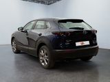 the back of a black mazda cx - hr parked in a garage