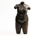 an image of a statue of a woman standing on a white surface