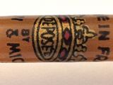 an image of a close up of a wooden stick with a crown on it