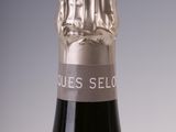 a bottle of wine that is sitting on a table