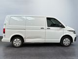 the white van is parked on the concrete floor in the room