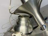 a metal object with a metal funnel on top of it