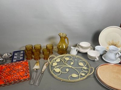 a table with a lot of dishes and cups on it