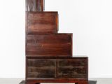 an image of a set of stairs made out of wood with wheels
