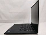 the laptop is sitting on a white surface with a white background