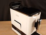 a coffee machine that is sitting on a wooden table