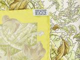 yellow and white fabric with a picture of a bird on it
