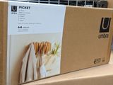 a cardboard box that has a bunch of clothes on it