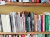 many books that are on the shelves in the room