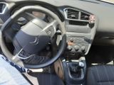 dashboard view of a car with a steering wheel and dashboard controls