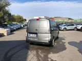 a silver van that is parked in a parking lot