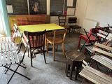 many chairs and tables in a room with a yellow table