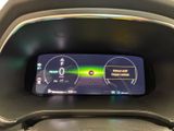 the dashboard of a car with a digital display in the center