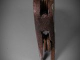 a close up of a piece of wood with a wrench on it