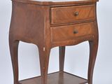 a small wooden table with a drawer on top of it