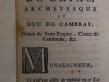 an old book that is open on a table