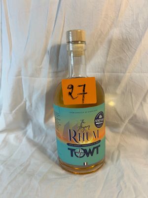 a bottle of rum that is sitting on a white sheet