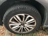 the tire of a car with a flat tire on the side of the road