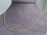 a gold chain necklace on a mannequin mannequin mannequin mannequin mannequin mannequin mannequin mannequin manne