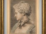 portrait of a woman in profile, in a blue dress and a gold frame
