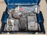 a blue tool case with tools in it on a table
