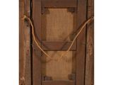 an old wooden frame with rope hanging from it ' s sides