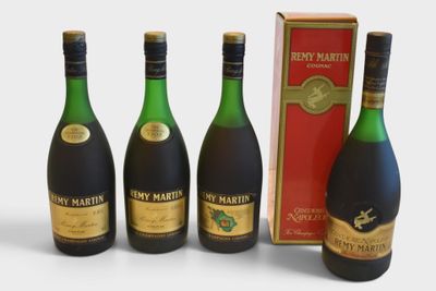 three bottles of wine and a box of wine on a white surface