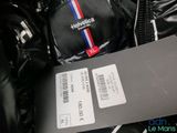 a black bag with a red, white, and blue stripe on it
