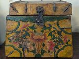 a wooden box with a floral design on it