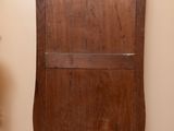 a wooden cabinet with a mirror on top of it