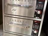 two ovens sitting on top of each other in a kitchen