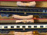 three train cars that are sitting in a box